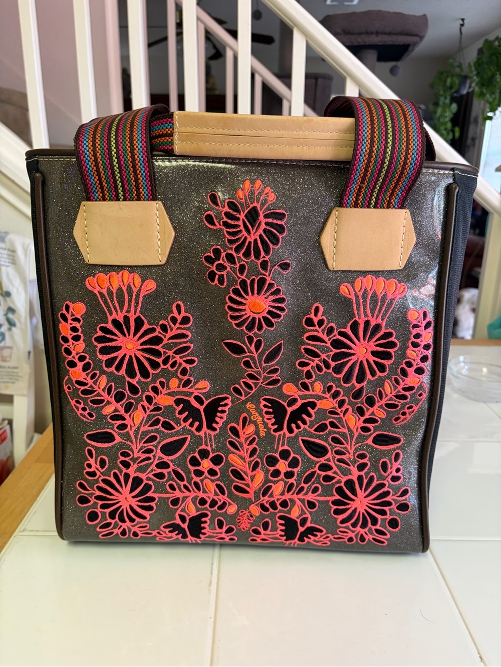 Consuela Black Tote with Neon Pink Floral Cutouts and Striped Handles